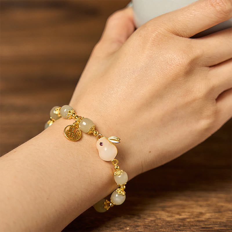 Wearing hetian jade rabbit bracelet on wrist showing fit and comfort for standard wrist size