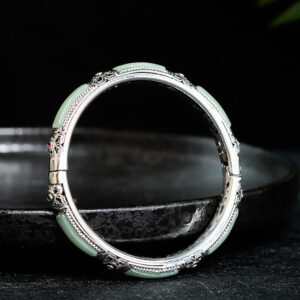 Handcrafted green agate jade copper cuff bracelet overhead front view, hinged vintage silver frame with uniform agate decorations
