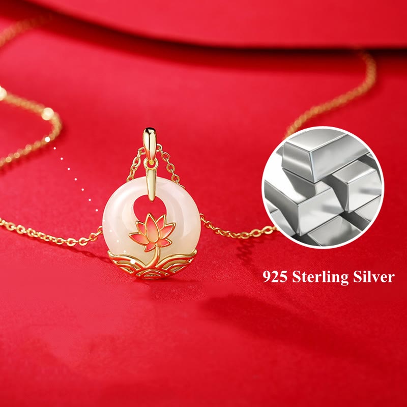 Hetian white jade lotus pendant necklace flat lay on red fabric showing 925 sterling silver marking and complete pendant with chain
