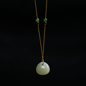 Hetian jade prosperity pendant necklace with small bag charm, light green rounded jade stone on yellow cord with gold and brown wooden spacer beads, front view