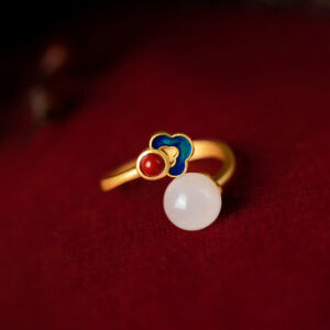 Handcrafted jade protection ring showing detailed cloisonné cloud ornament with blue and red enamel accents and hanging white jade stone