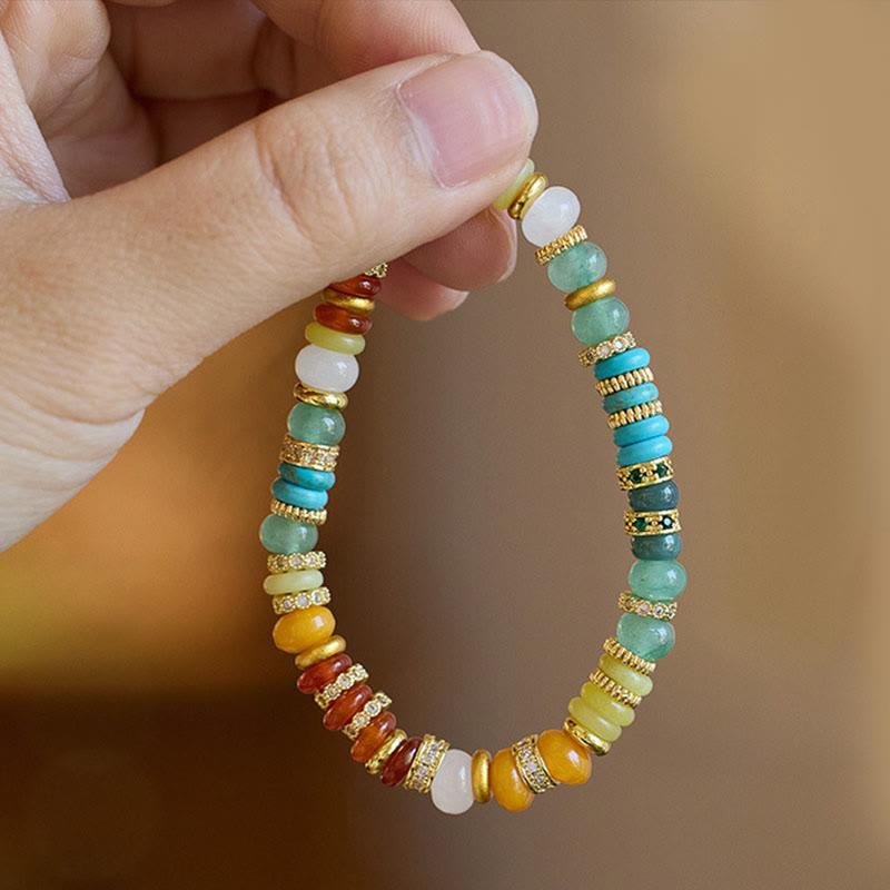 Close-up detailed view of rainbow jade bracelet beads showing red agate turquoise yellow agate and jade stones