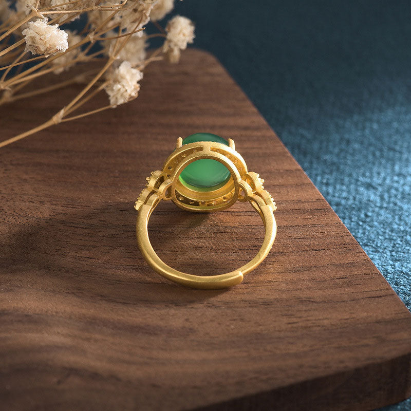 Green jade fortune ring rear overhead view showing gold band construction