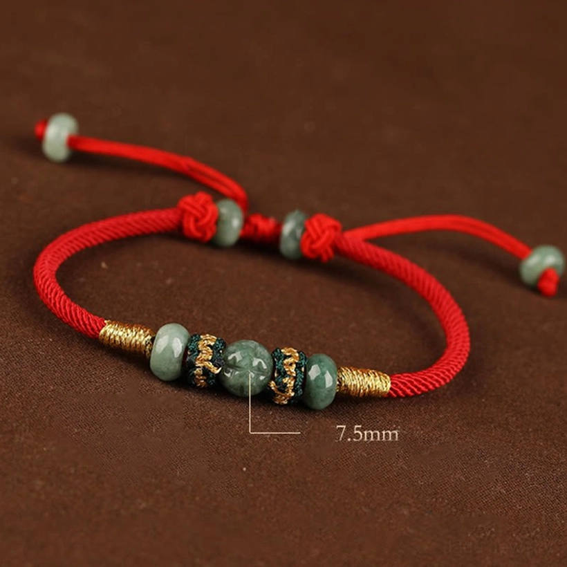 Adjustable jade prosperity bracelet detail showing knot adjuster mechanism and jade bead sizing