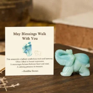 Amazonite stone elephant figurine with May Blessings Walk With You blessing card on wooden table