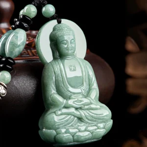 Amitabha Buddha jade pendant necklace three-quarter view with beaded chain on brown vessel