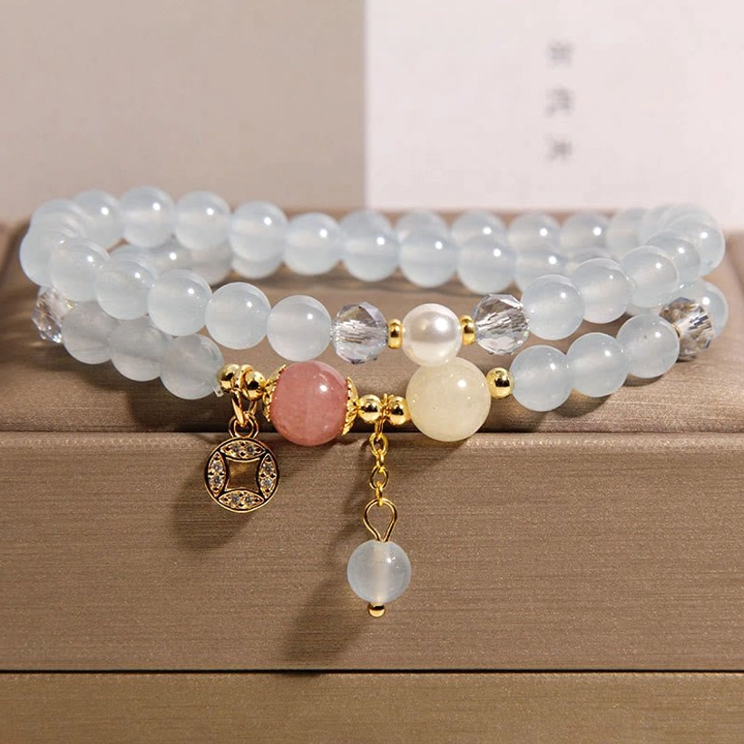 White jade and aquamarine double wrap bracelet with copper coin charm and clear gemstone pendant