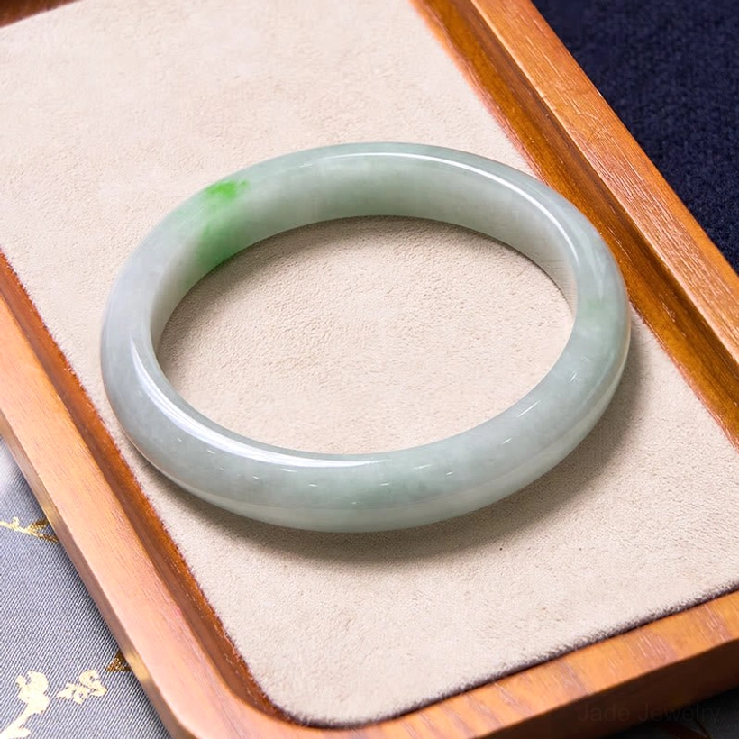 Natural green jade bangle with authentic coloring and handcrafted quality perfect for daily wear