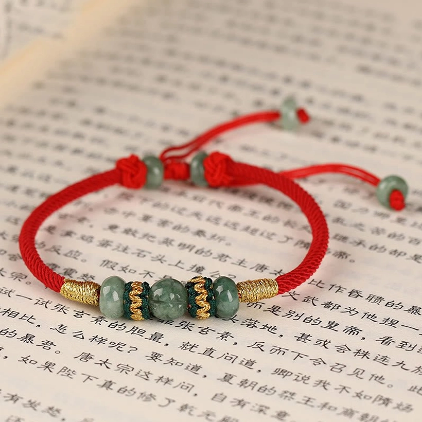 Authentic handmade jade prosperity bracelet laying flat highlighting premium materials and craftsmanship