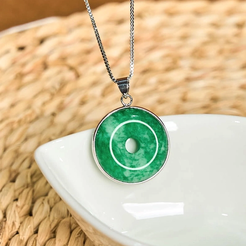 Authentic jade peace buckle pendant - intricate bezel design craftsmanship showing artisan quality metalwork