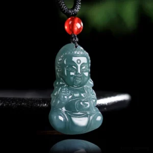 Baby Buddha dark jade pendant necklace with black rope and red bead accent, studio front oblique view