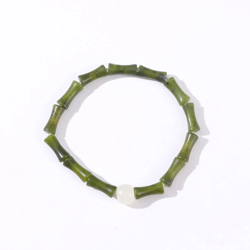 Green bamboo jade bracelet displayed on white background, minimalist styling with elastic string