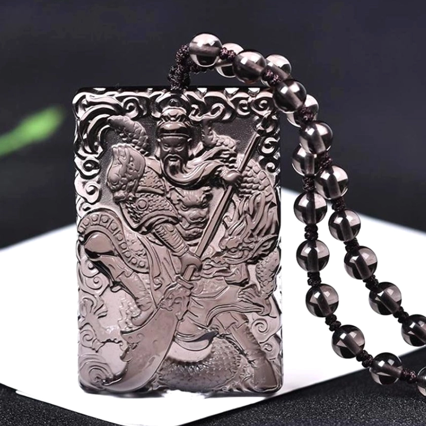 Black onyx Lord Guan protection pendant with carved Guangong figure and fortune strength symbols paired with black bead necklace chain