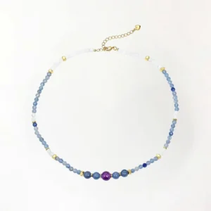 Blue aventurine white jade amethyst beaded necklace with gold spacers on white background, top-down view showing full strand and adjustable chain