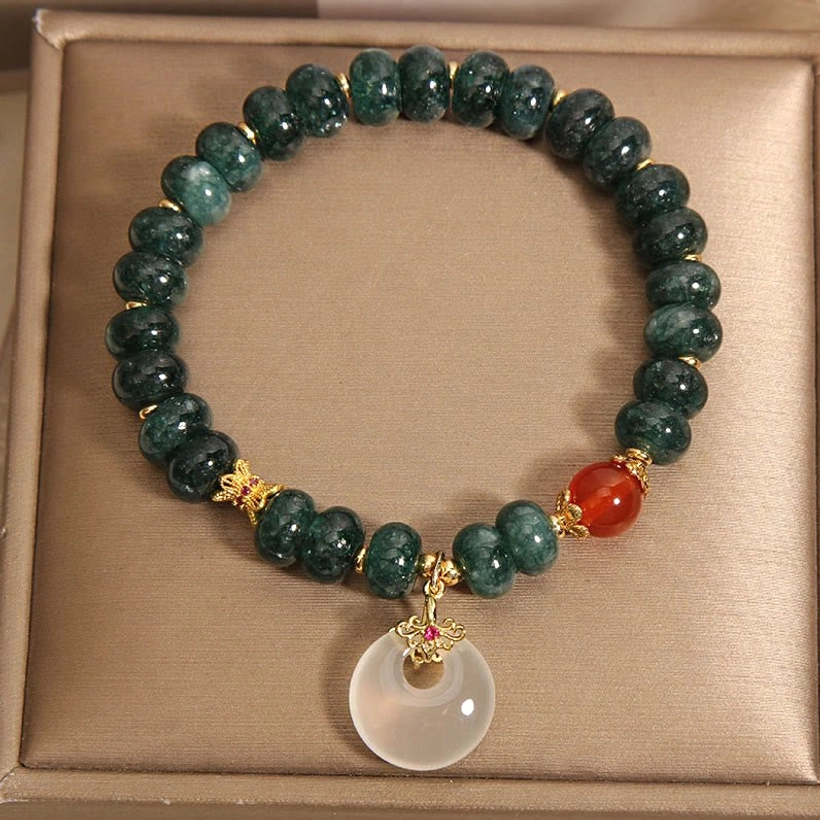 Full circular jade beaded bracelet with white jade peace buckle pendant and red agate accent in luxury gift packaging