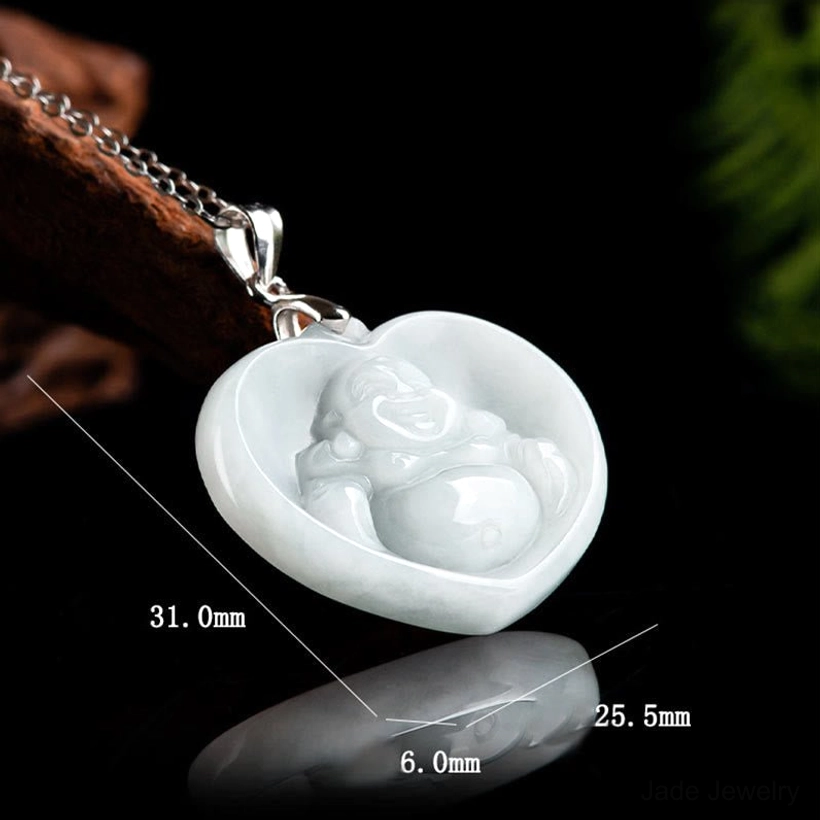 Carved laughing Buddha jade heart pendant with dimension measurement marks, right oblique professional detail shot