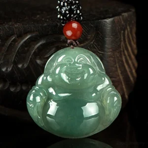 Maitreya Buddha jade pendant overhead angled view showcasing intricate carved design and natural jade luster