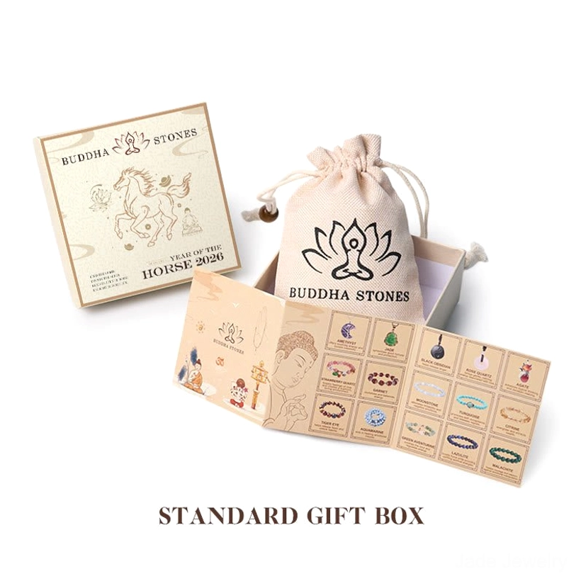 Buddha Stones branded gift set including jewelry box, decorative lotus drawstring bag, and product information brochures on white background