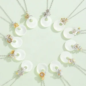 Collection of chalcedony flower harmony pendant necklaces with silver and gold clasps, flat lay overhead view