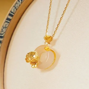 925 sterling silver chalcedony peace buckle necklace with golden flower detail on embroidered tray - side view