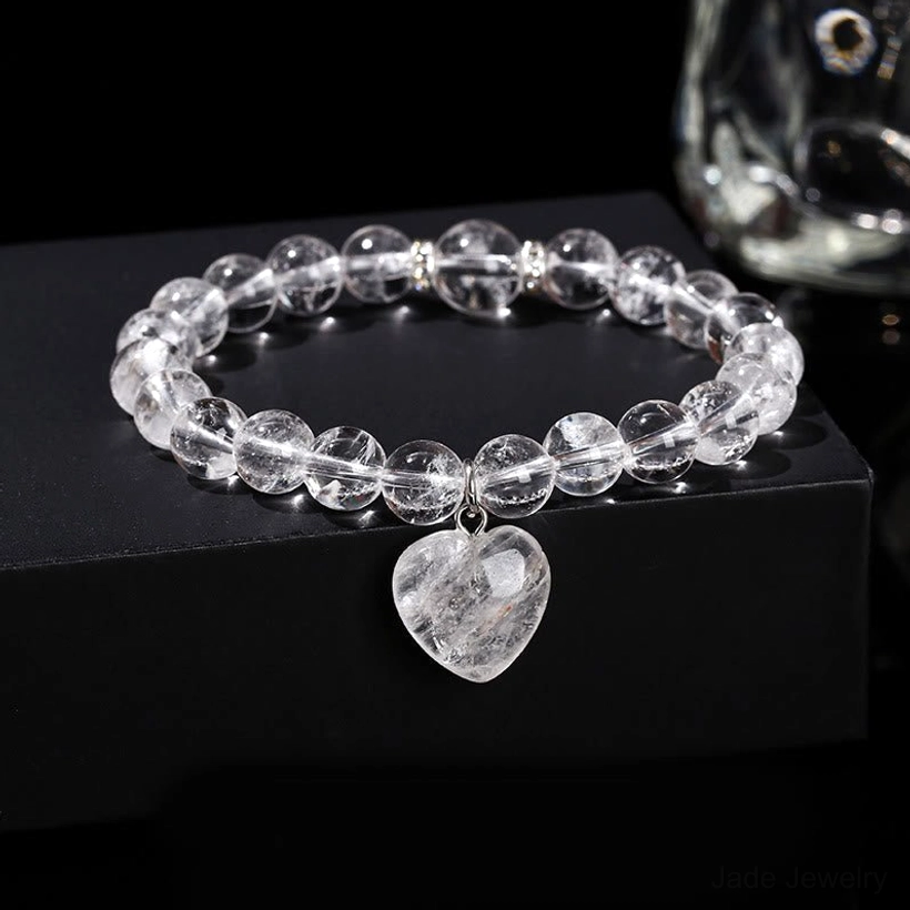 Clear Quartz crystal beaded heart bracelet on display stand