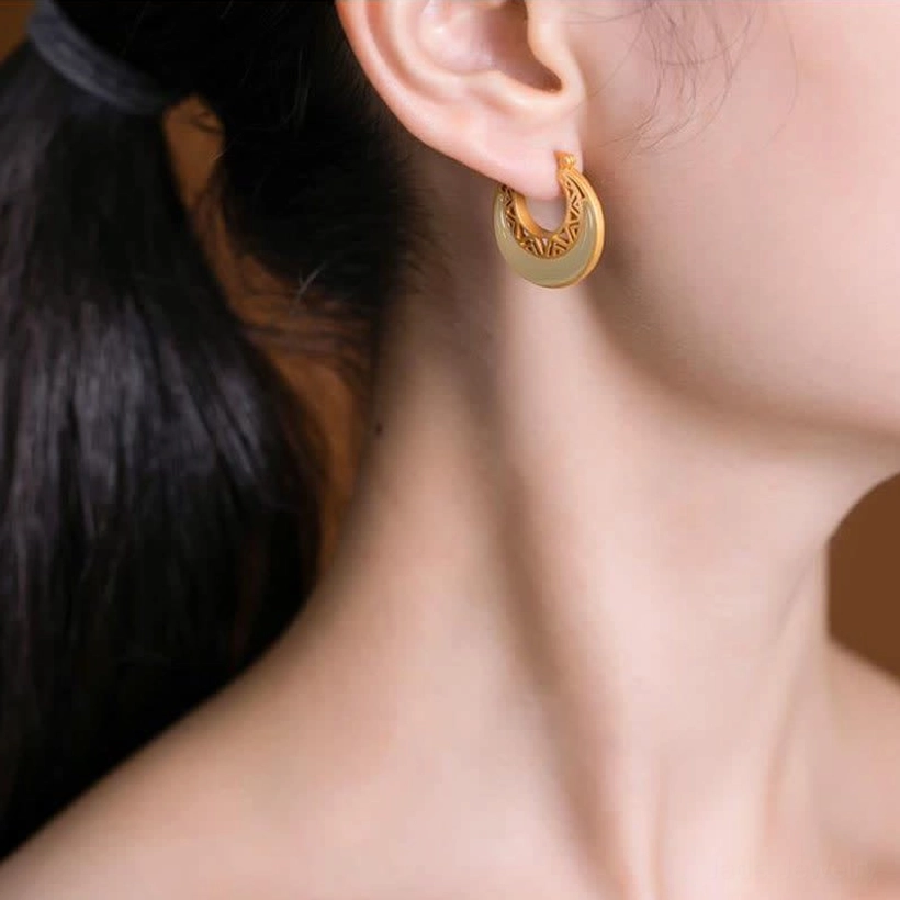 Woman wearing crescent moon jade drop earrings, partial face profile showing real-life wearing effect and celestial design