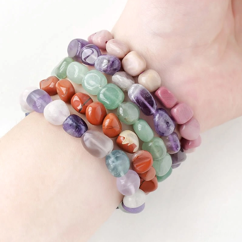 Multi-color natural stone crystal bracelet worn on human wrist showing elastic fit and comfort