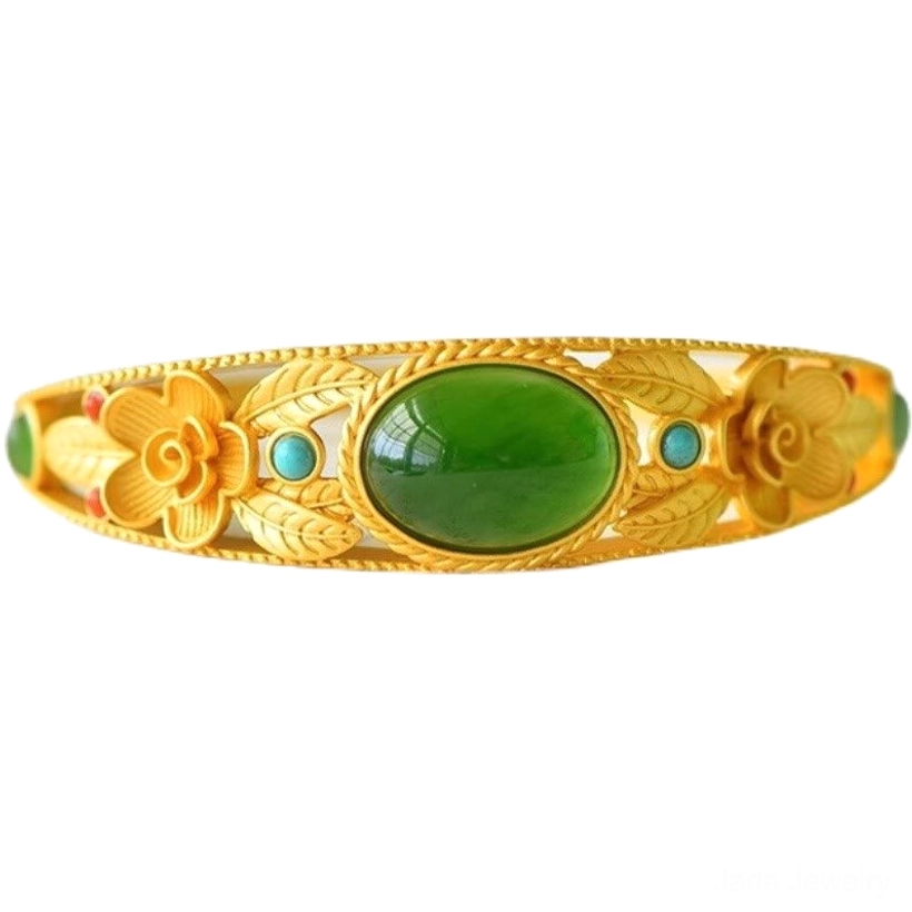 Handmade jade bangle with delicate floral hollow carvings and oval cyan jade centerpiece, traditional craftsmanship
