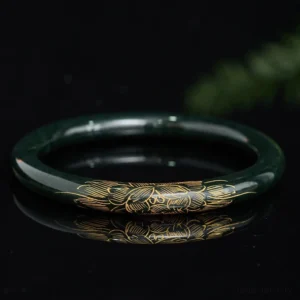 Natural cyan jade bangle bracelet with carved lotus and koi fish motifs, top-down flat lay