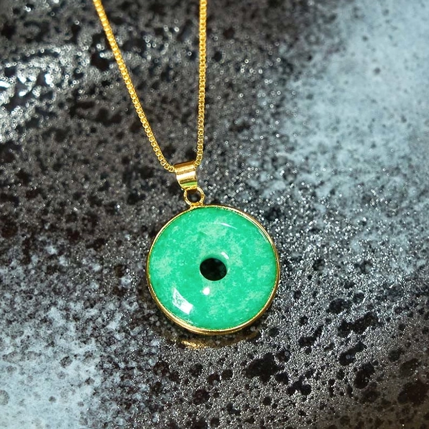 Emerald-green cyan jade peace buckle necklace - close-up detail revealing natural jade texture and color depth