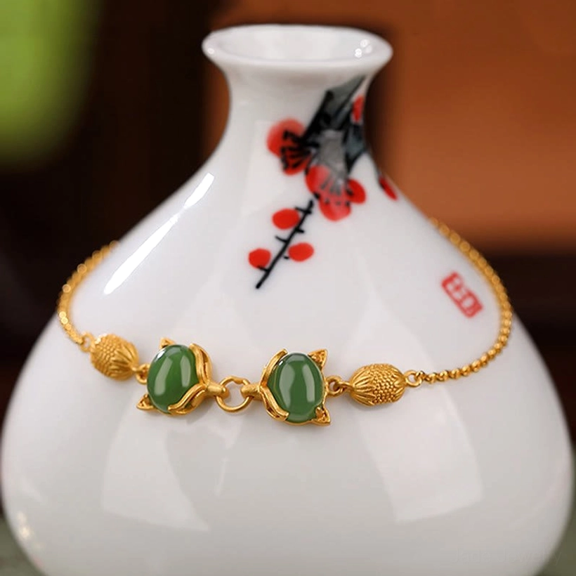 Cyan jade fox bracelet close-up showing detailed jade beads and silver fox charm on porcelain background
