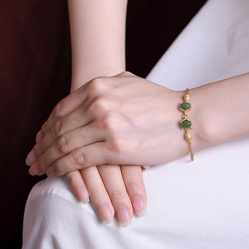 Hetian cyan jade fox bracelet worn on wrist, lifestyle view showing adjustable fit and daily wear styling