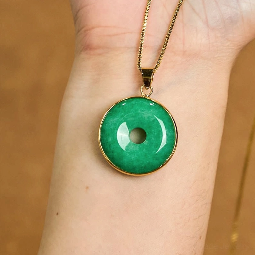 Cyan jade peace buckle necklace worn on wrist - lifestyle modeling shot showing comfortable everyday wear