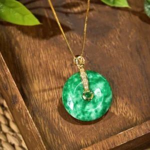 Cyan jade peace buckle necklace side angle view showing polished jade texture marbling and elegant gold-tone setting detail