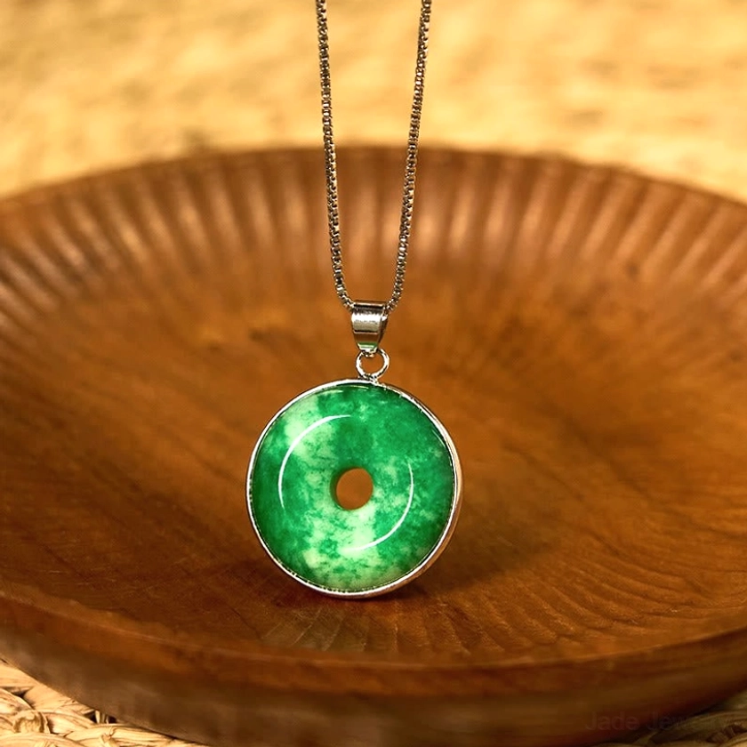 Cyan jade peace buckle necklace with silver bezel - detailed pendant view showing refined metalwork and jade luster