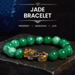 Cyan jade Pixiu protection bracelet flat lay featuring green jade beads with ornate gold Pixiu charm