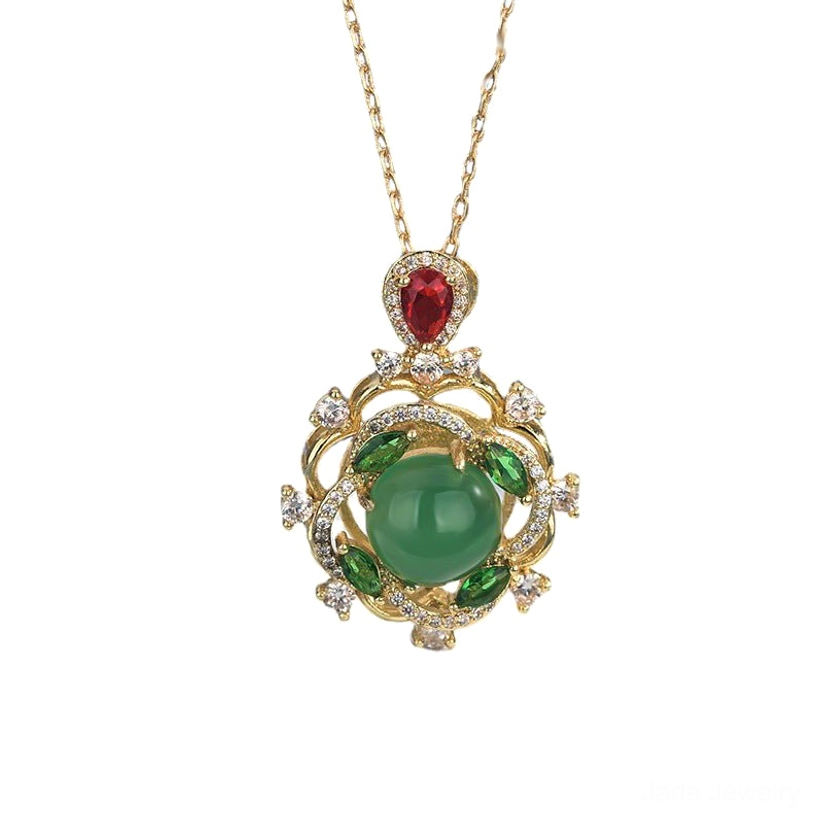 Cyan jade and red crystal healing necklace with gold filigree pendant, flat lay front view