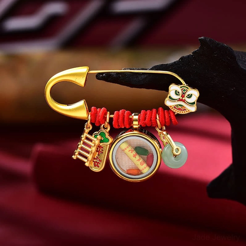 Two dancing lion brooch styles comparing face pendant and peace buckle designs side by side