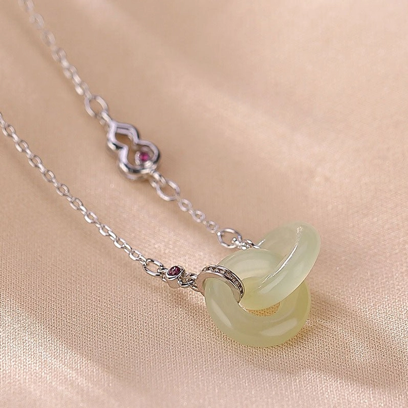 Double jade hoop prosperity necklace detail shot showing craftsmanship and jade stone quality