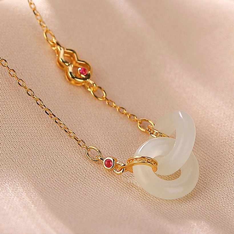 Gold jade double hoop necklace with interlocking white nephrite jade hoops and gem-set chain