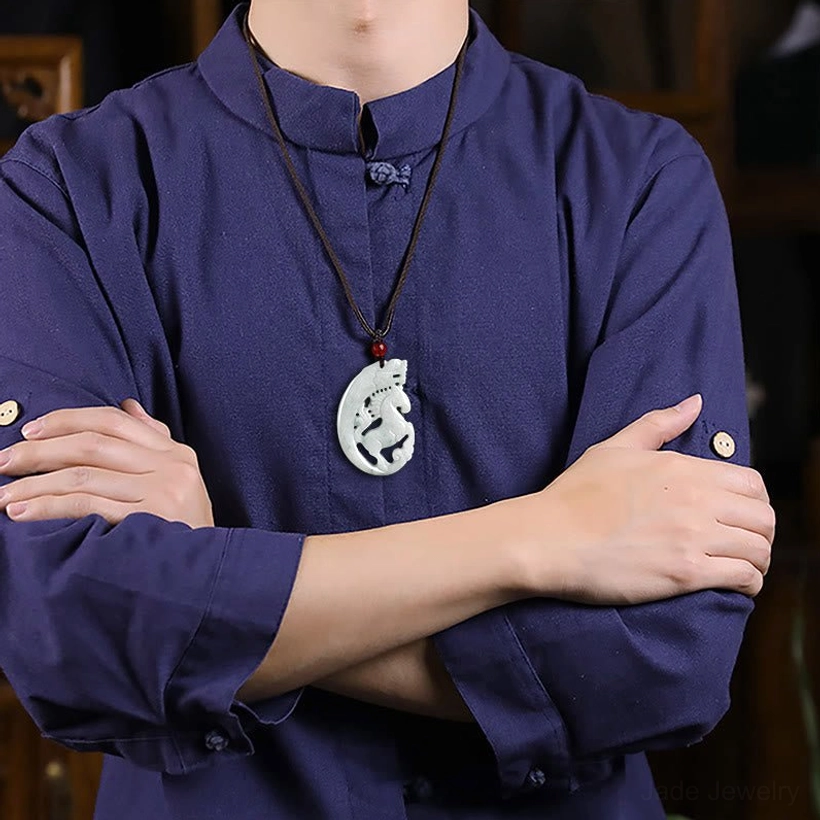 Jade dragon horse pendant necklace worn at collar height with traditional clothing background showing daily wear styling