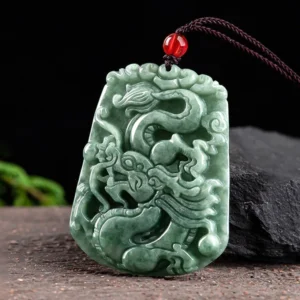 Three-quarter angle view of hand-carved dragon jade pendant showing natural jade texture and relief details