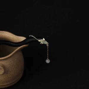 Traditional ebony fish blessing hairpin side angle showing jade carving and metal details