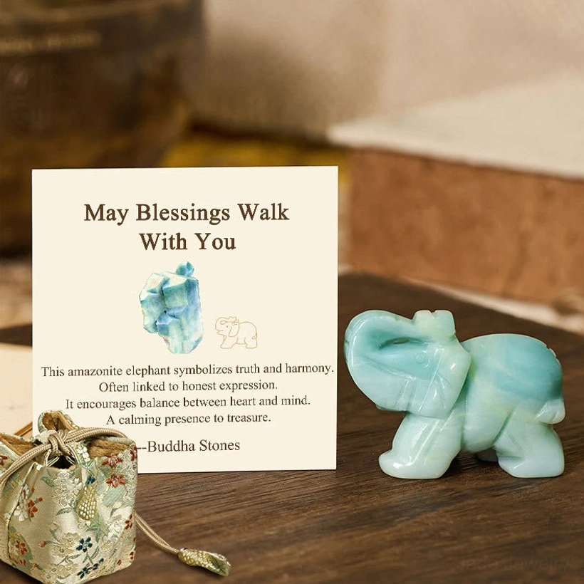 Complete elephant stone gift set with blessing card and decorative pouch on wooden surface