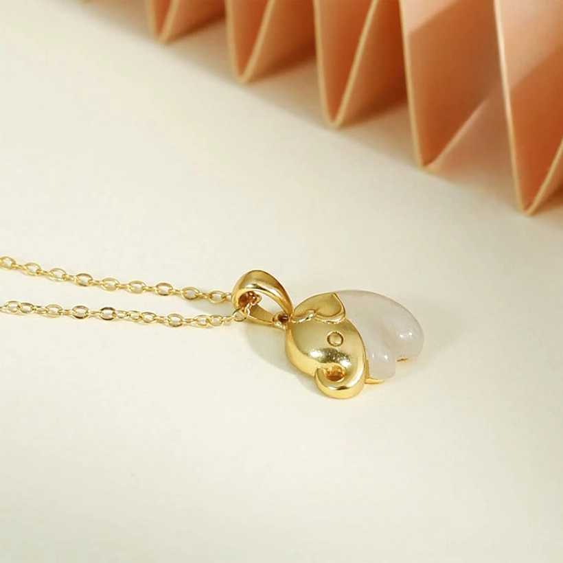 White Hetian jade elephant pendant side profile view, detailed craftsmanship showcase