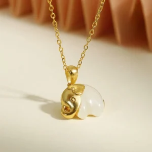 Handcrafted elephant jade necklace pendant with silver chain, front eye-level product photography
