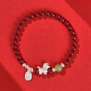 Single fire horse cinnabar beaded bracelet with 3D sterling silver horse pendant and blessing tag on red fabric