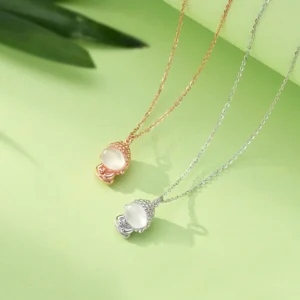 Flat lay comparison of two formless Buddha chalcedony necklaces in rose gold and silver finish with identical pendant design