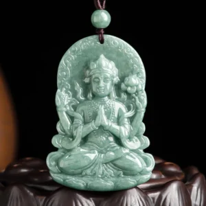 Four-armed Avalokitesvara natural jade pendant carved amulet on wooden lotus stand displaying intricate Buddhist design