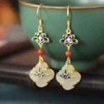 Four leaf clover jade drop earrings with gold plated copper hooks and cloisonné enamel flower design front view